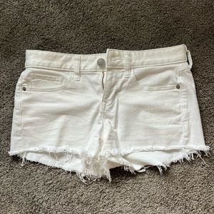 White denim shortie low rise stretch shorts from Express